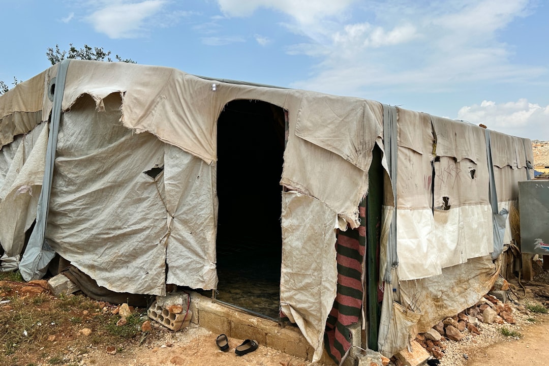 A group of tents sitting on top of a dirt field