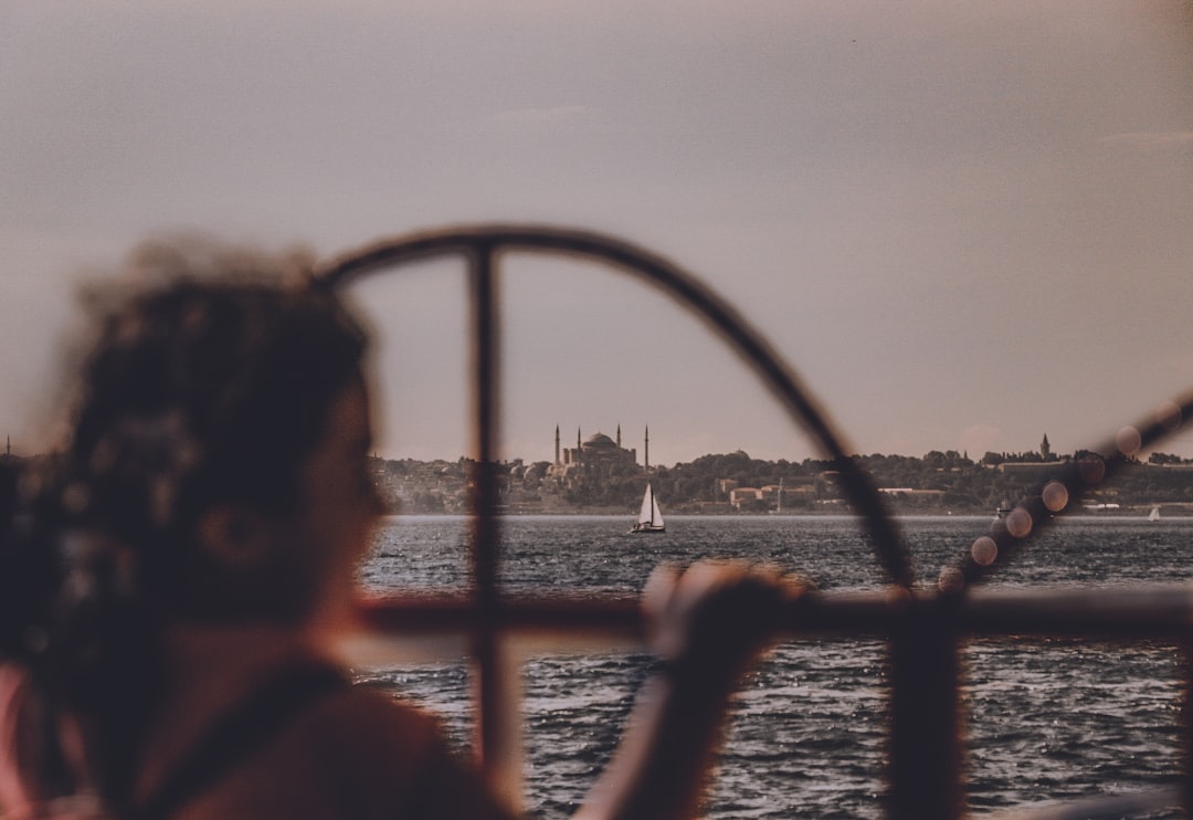 a woman looking out over a body of water