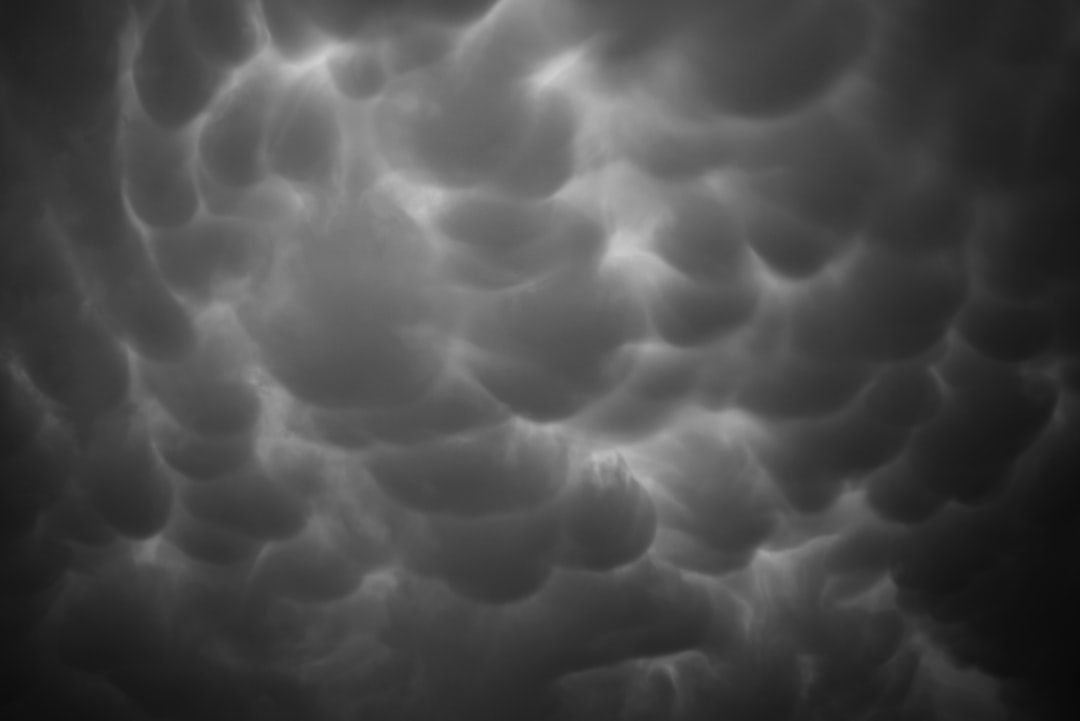 A black and white photo of clouds in the sky