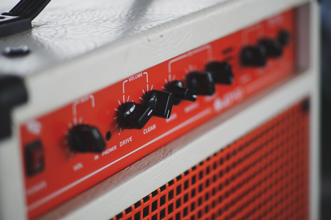 white and orange guitar amplifier